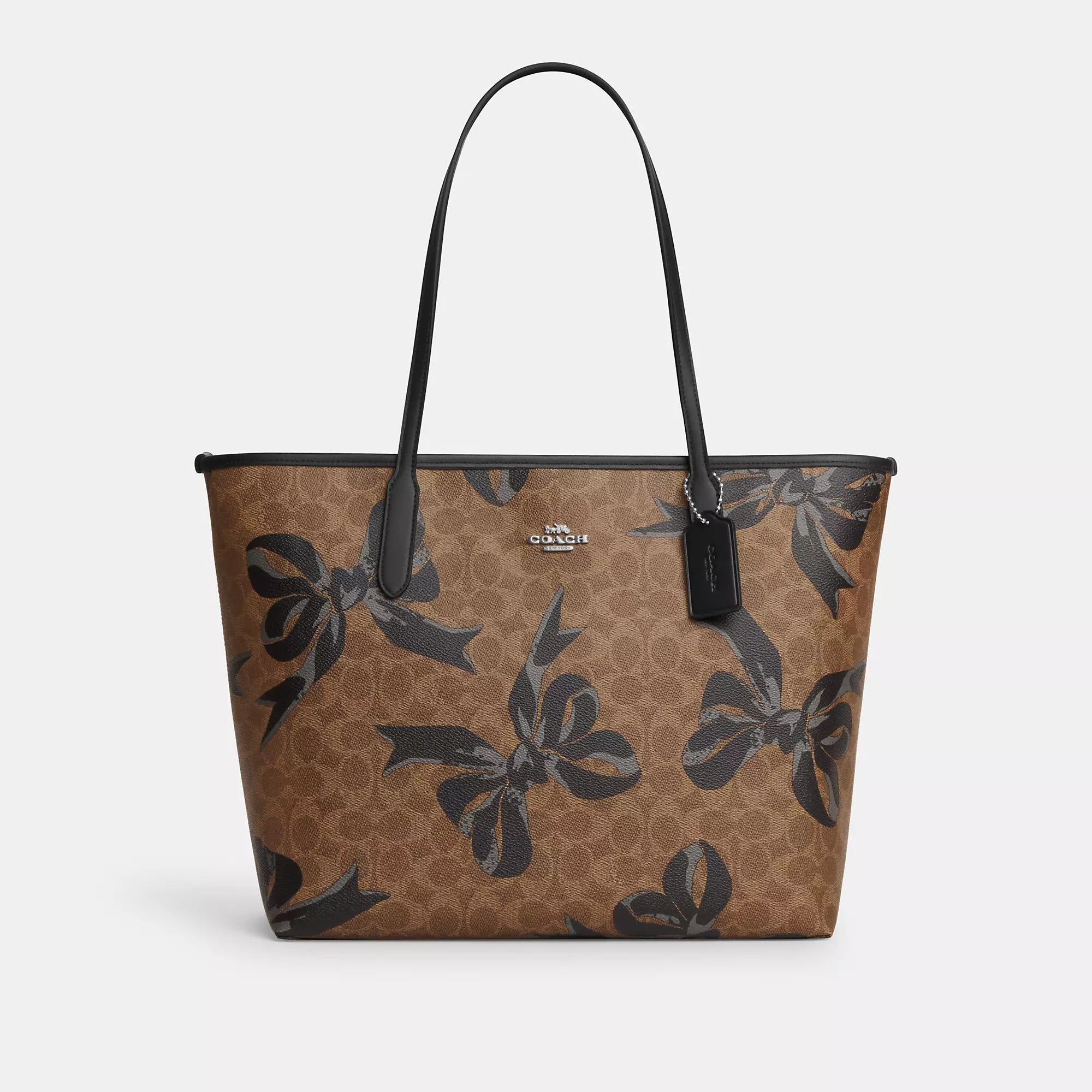 Coach shoulder bags for everyday wear -Coach Outlet City Tote Bag In Signature Canvas With Bow Print