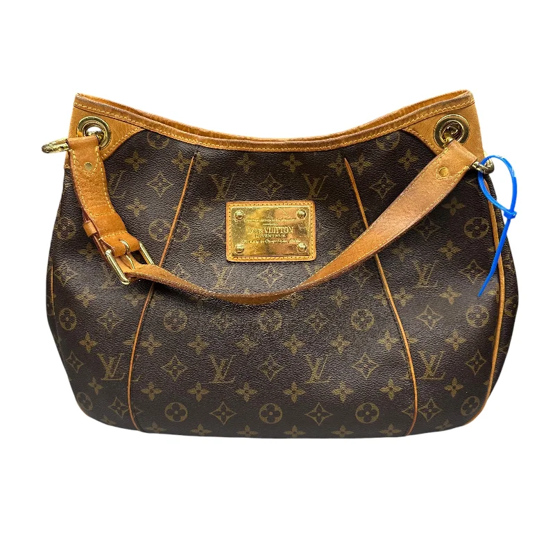 Louis Vuitton handbags for city chic styling -Handbag Luxury Designer By Louis Vuitton In Brown